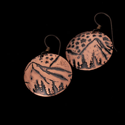 Handcrafted copper mountain landscape earrings with night sky and niobium ear wires.