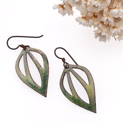 Green enamel leaf-shaped earrings with openwork design and sterling silver ear wires.