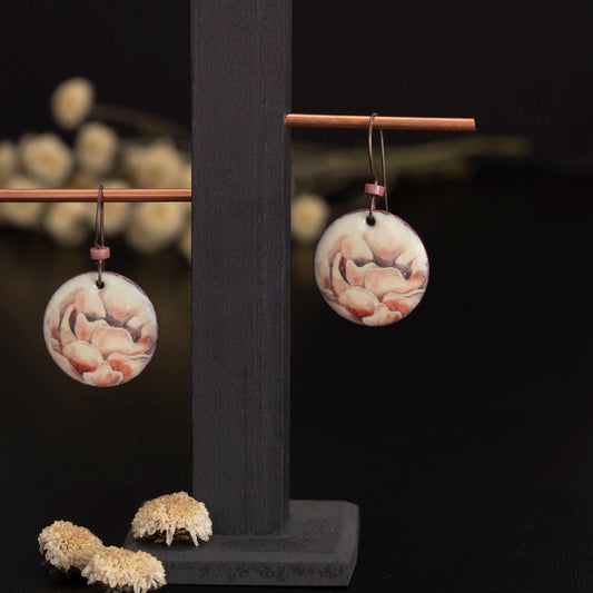 Round enamel earrings with soft peach rose floral design on copper and niobium ear wires