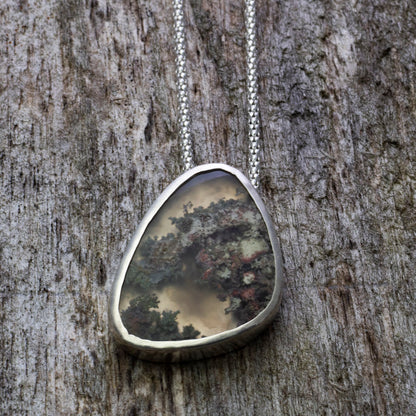 Dendritic agate sterling silver necklace with mossy woodland pattern, 0.87 x 1.4 inch pendant, and 18 inch sterling silver chain by Divella Designs.