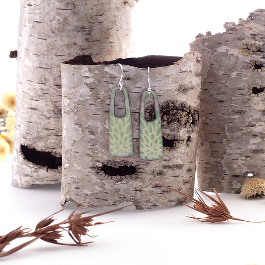 Pale green enamel rectangle earrings with floral pattern and open window design on copper, sterling silver ear wires