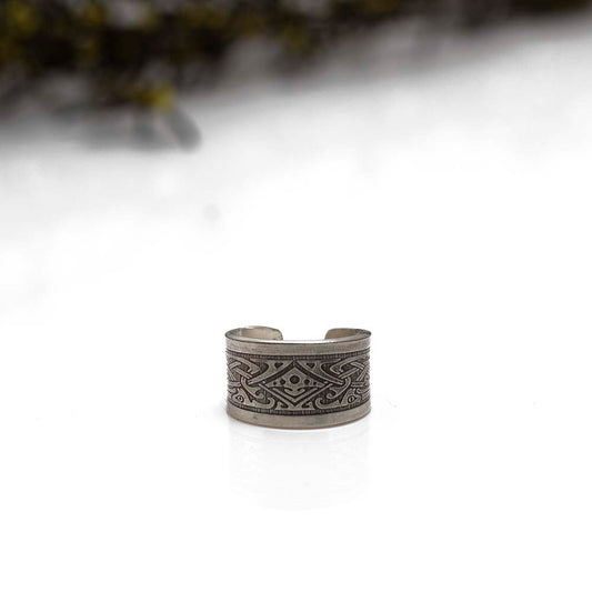 Sterling silver ear cuff with intricate geometric pattern and engraved finish