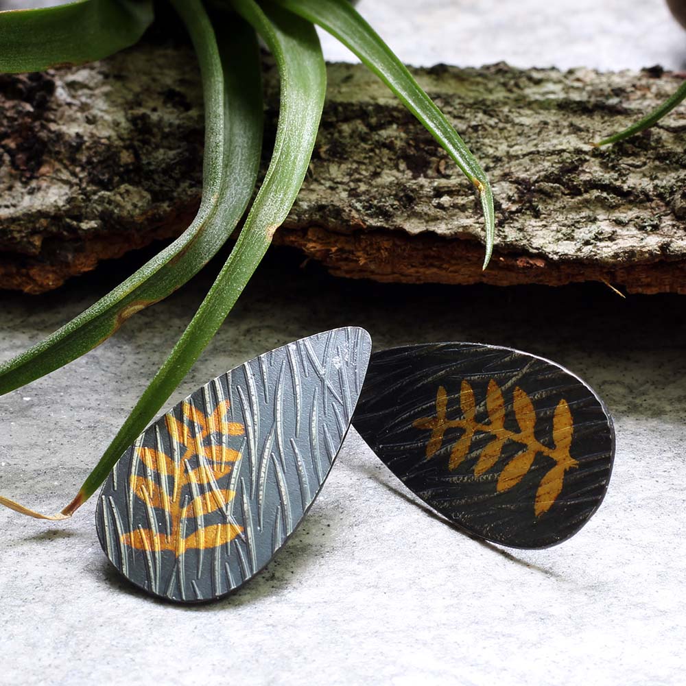 Sterling silver and 24k gold Keum Boo earrings with fern design and sterling silver posts, handmade by Divella Designs in Vermont.
