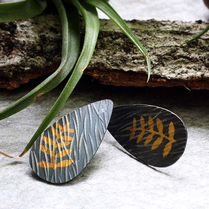 Sterling silver and 24k gold Keum Boo earrings with fern design and sterling silver posts, handmade by Divella Designs in Vermont.