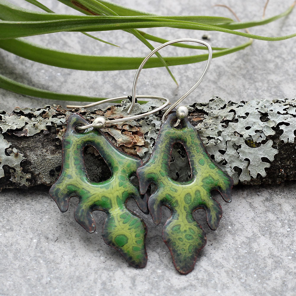 Green kiln-fired enamel frond earrings on copper with sterling silver or niobium ear wires, handmade by Divella Designs in Vermont.
