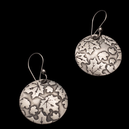 Sterling silver earrings with etched oak and maple leaf pattern, inspired by Vermont forests.