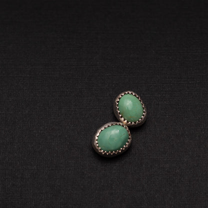 Sterling silver stud earrings with 11mm King’s Manassa turquoise stones.