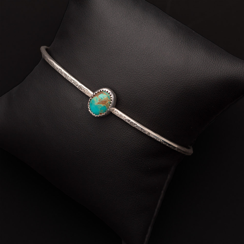 Turquoise from the King's Manassa mine and silver form a petite cuff great for stacking.