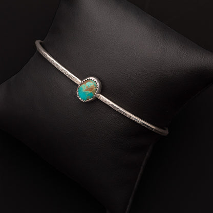 Turquoise from the King's Manassa mine and silver form a petite cuff great for stacking.