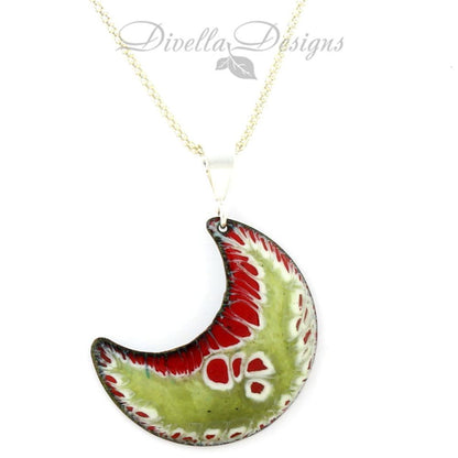 Crescent-shaped enamel pendant in red, green, and white with sterling silver bail