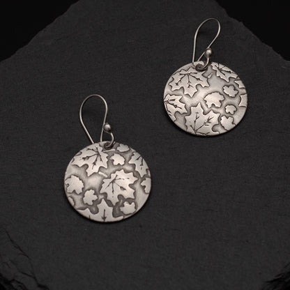 Sterling silver earrings with etched oak and maple leaf pattern, inspired by Vermont forests.