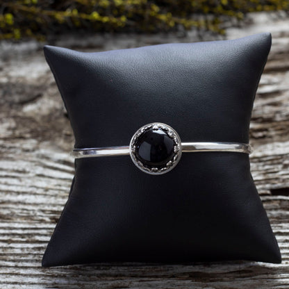 Sterling silver cuff bracelet with 14mm black onyx cabochon in gallery bezel, handcrafted in Vermont, 6-inch length with 1-inch gap.