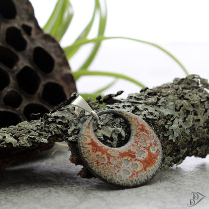 Swirled enamel pendant with fossil-inspired texture and sterling silver bail