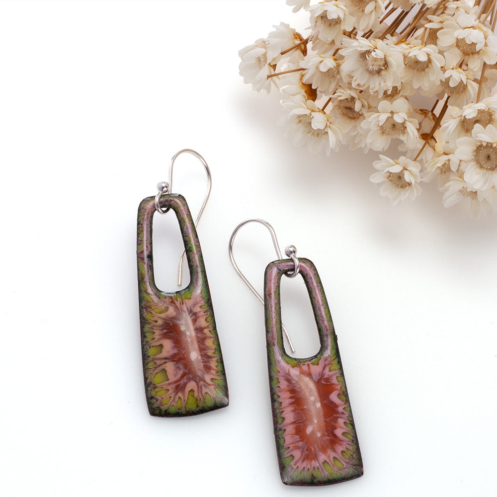 Pink and green enamel earrings with sterling silver ear wires on white background