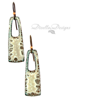 Cream and brown enamel earrings with open arch design and niobium ear wires