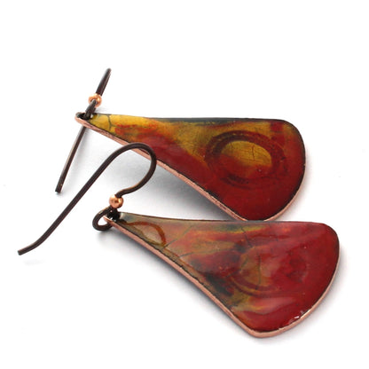 Red and gold enamel earrings with abstract flame pattern and niobium ear wires