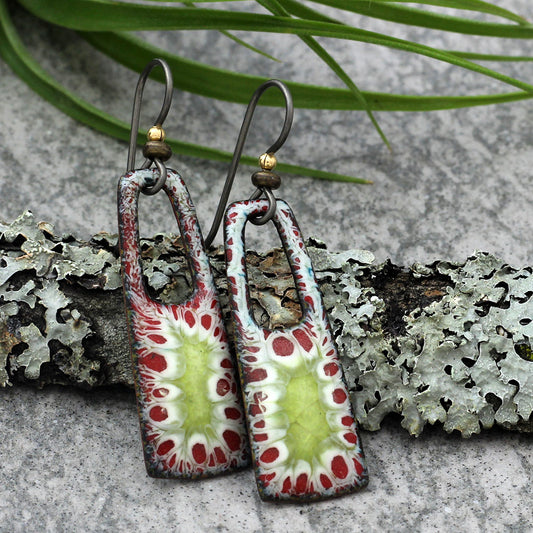 Enamel earrings with red, green, and white organic burst pattern and niobium ear wires