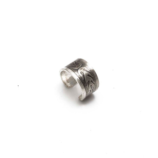 Sterling silver ear cuff with engraved flame motif and brushed finish