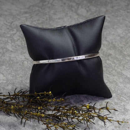 Sterling silver hammered cuff bracelet with a minimalist design, perfect for stacking, handmade jewelry