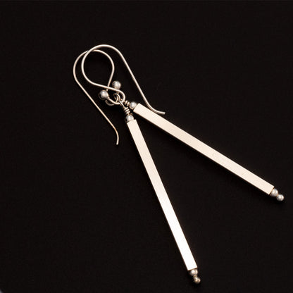 Long sterling silver drop earrings with minimalist bar design