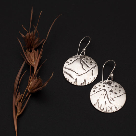 Sterling silver mountain and star scene disc earrings with handmade ear wires.
