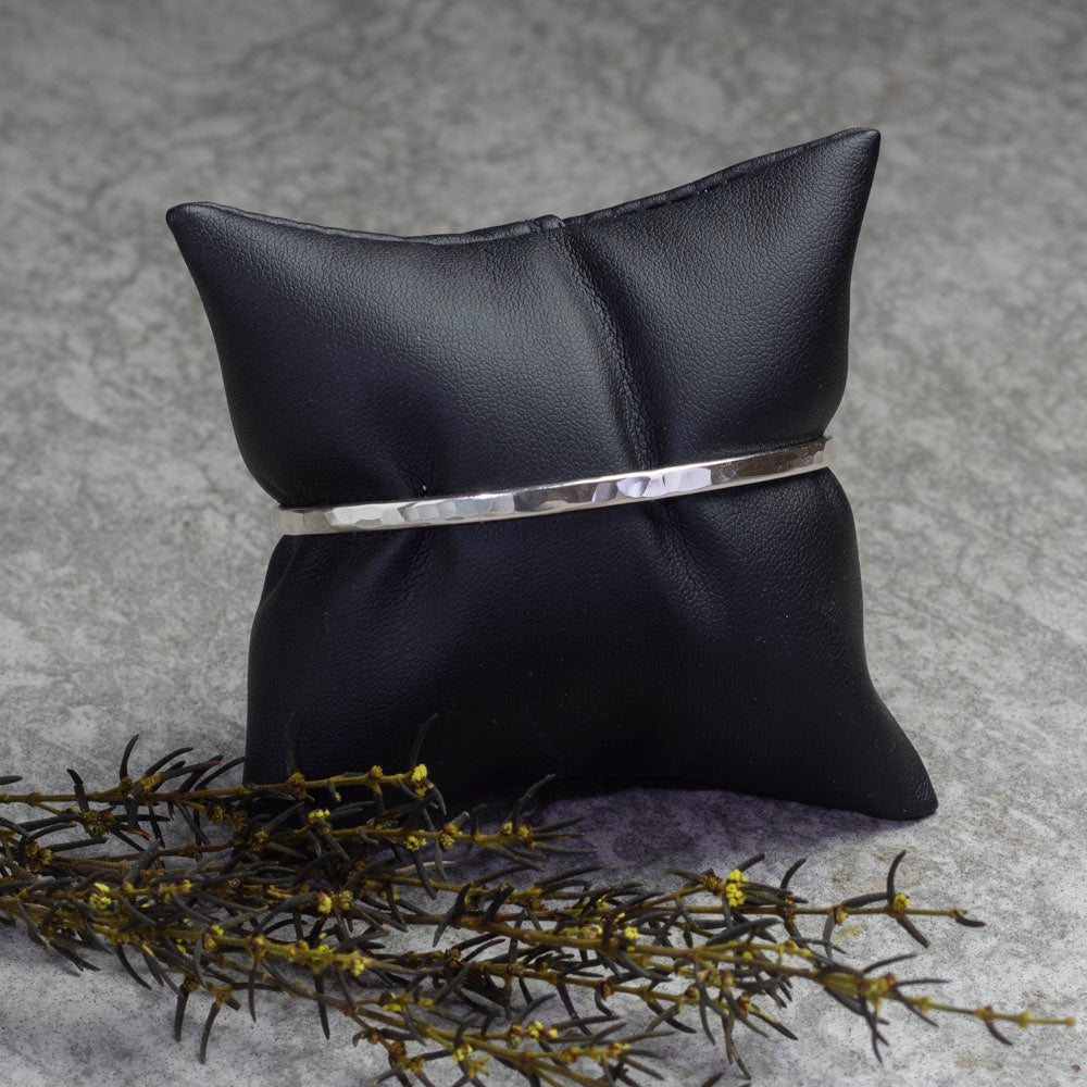 Sterling silver hammered cuff bracelet with a minimalist design, perfect for stacking, handmade jewelry