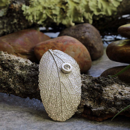 Sterling silver sage leaf necklace with small gemstone accent on an 18 inch chain, handmade by Divella Designs in Vermont.
