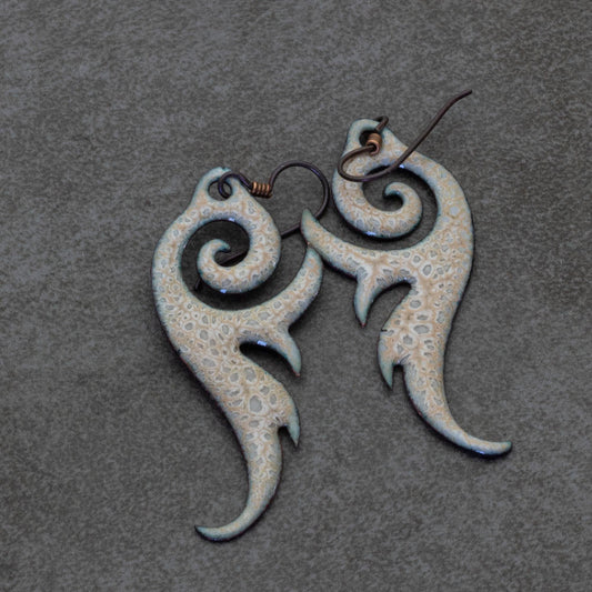 Enameled copper earrings with textured scroll design and niobium ear wires