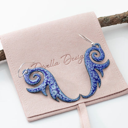 Blue enameled copper swirl earrings with niobium ear wires and ocean-inspired design