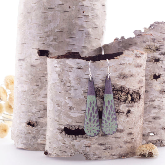 Handmade enamel drop earrings in deep plum and sage green with botanical pattern, sterling silver ear wires.
