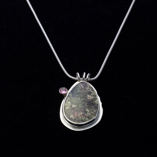 Teardrop dendritic agate pendant with pink tourmaline on sterling silver chain.