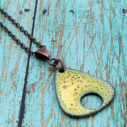 Triangular enamel pendant with yellow-green texture on oxidized copper chain