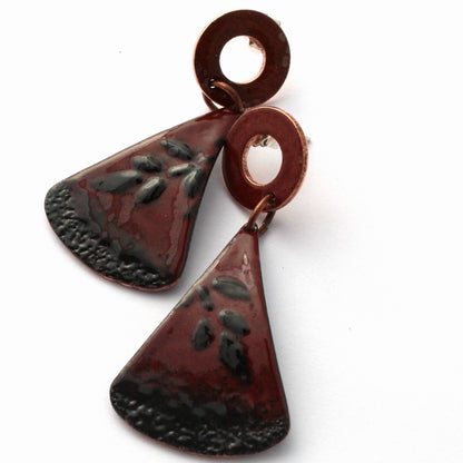 Red and black enamel earrings with textured design and sterling silver posts