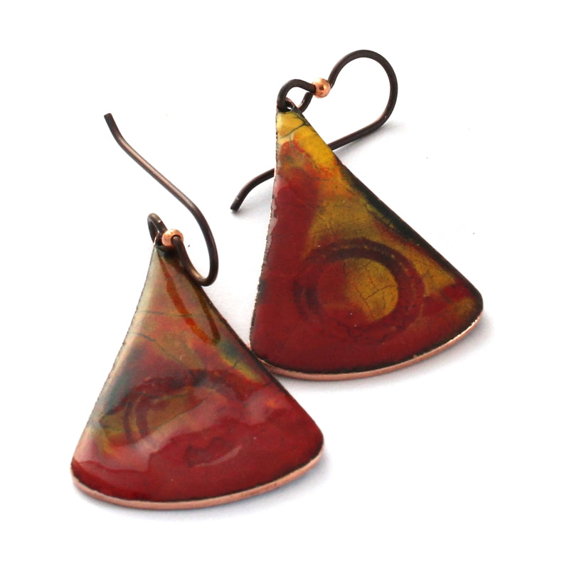 Red and gold enamel earrings with abstract flame pattern and niobium ear wires