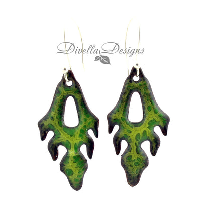 Frond shaped boho earrings in light and dark greens. The ear wires are sterling silver.